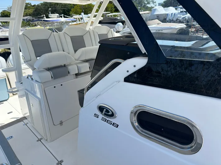  Yacht Photos Pics 2020 Pursuit S368 boat interior with cushioned seating and sleek design.