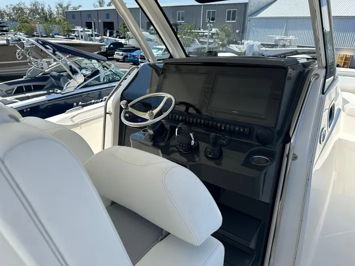  Yacht Photos Pics 2020 Pursuit S368 boat helm with modern controls and steering wheel.