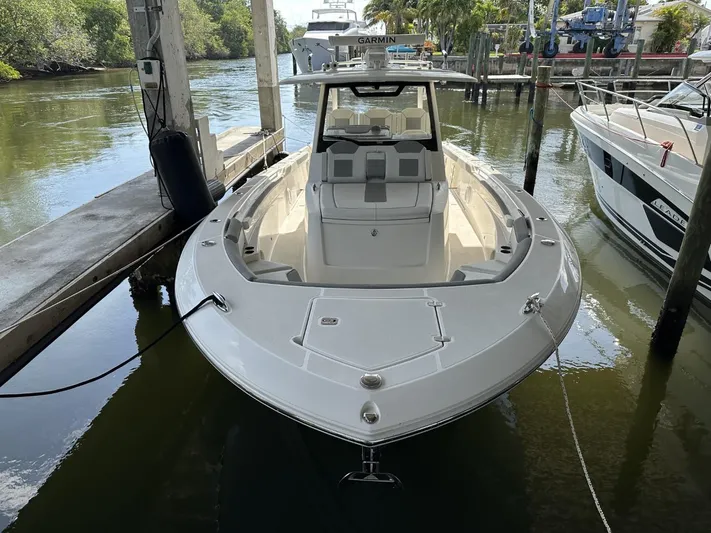  Yacht Photos Pics 2020 Pursuit S368 boat docked in a marina, front view.