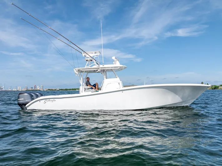  Yacht Photos Pics 2021 Yellowfin 34 boat on water with clear blue sky background.