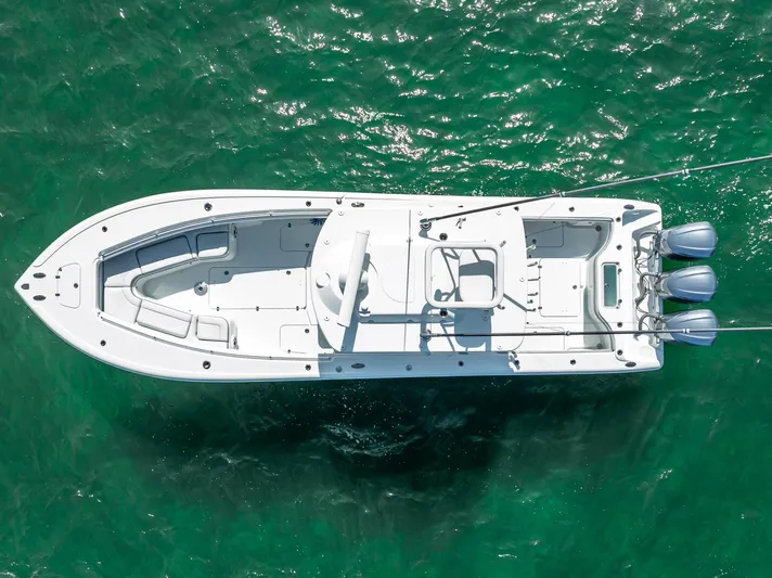  Yacht Photos Pics Aerial view of 2021 Yellowfin 34 boat on clear green water.