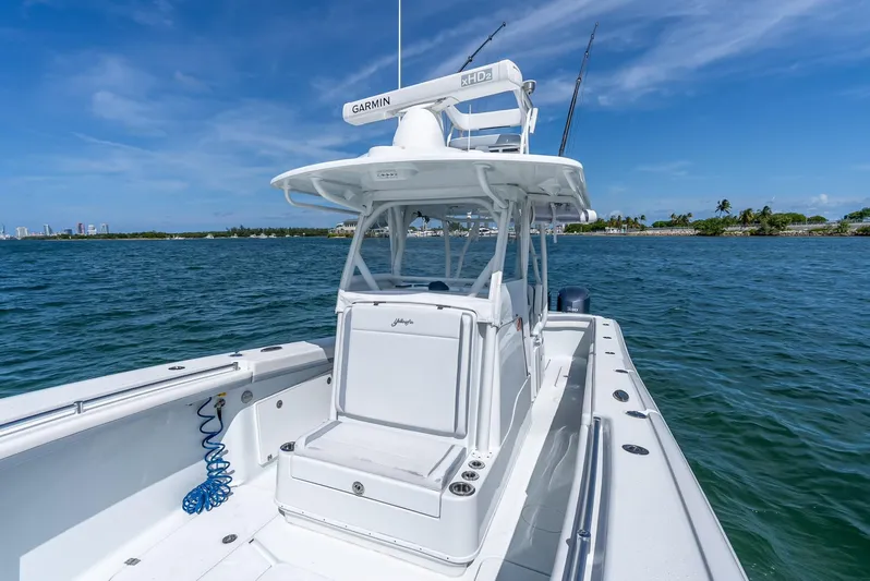  Yacht Photos Pics 2021 Yellowfin 34 boat on calm blue water with clear skies.