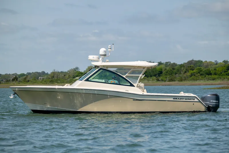  Yacht Photos Pics 2015 Grady-White Freedom 375 boat on calm water, side view.