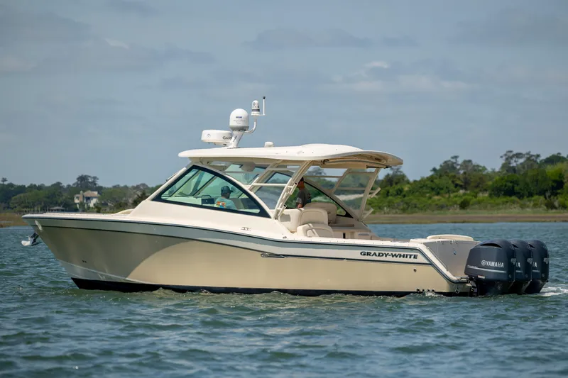  Yacht Photos Pics 2015 Grady-White Freedom 375 boat cruising on water with Yamaha engines.