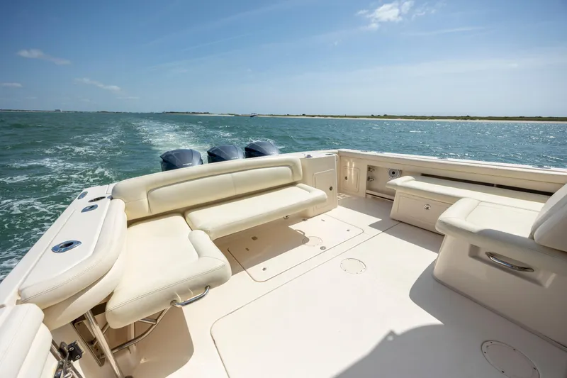  Yacht Photos Pics 2015 Grady-White Freedom 375 boat with spacious seating on open water.