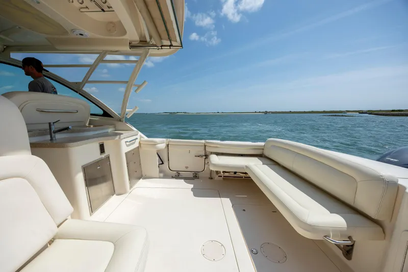  Yacht Photos Pics 2015 Grady-White Freedom 375 boat interior with seating, overlooking calm waters.