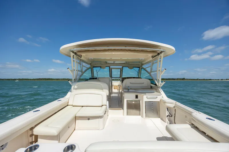  Yacht Photos Pics 2015 Grady-White Freedom 375 boat on open water under clear blue sky.