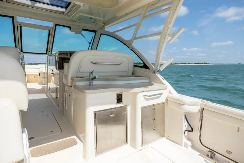 Yacht Photos Pics 2015 Grady-White Freedom 375 boat interior with ocean view, featuring luxurious seating and amenities.