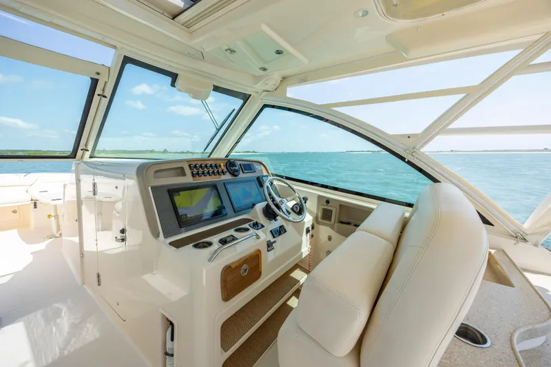  Yacht Photos Pics 2015 Grady-White Freedom 375 boat interior with modern dashboard and ocean view.