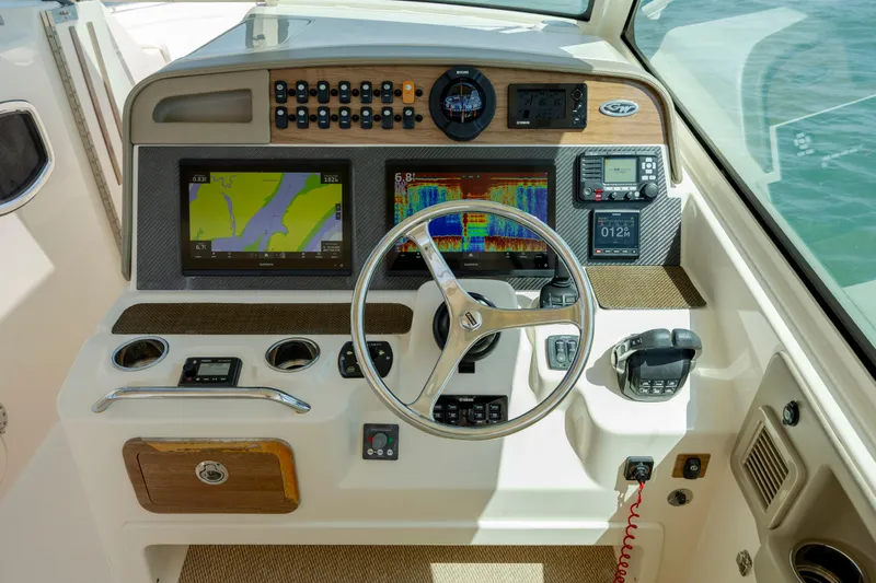  Yacht Photos Pics Helm of 2015 Grady-White Freedom 375 boat with navigation and control systems.