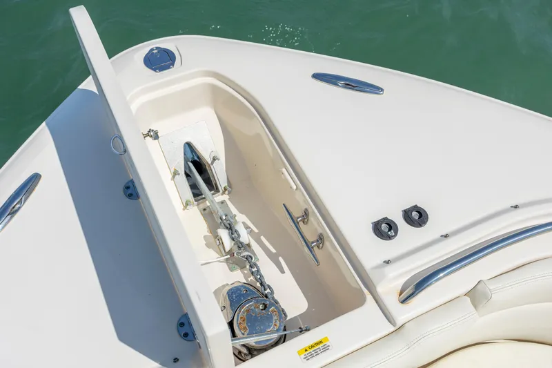  Yacht Photos Pics 2015 Grady-White Freedom 375 boat anchor compartment with chain, open lid, and sleek design.