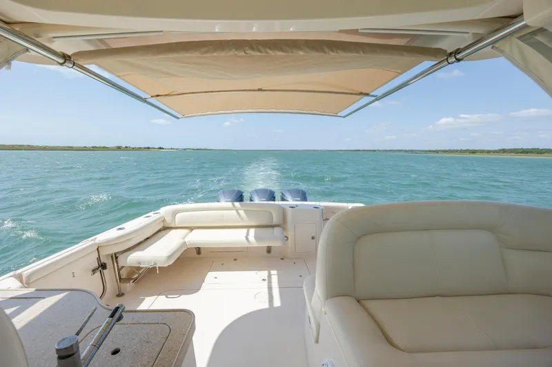  Yacht Photos Pics 2015 Grady-White Freedom 375 boat cruising on open water under a sunny sky.