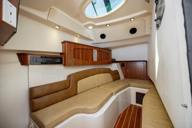  Yacht Photos Pics Interior of 2015 Grady-White Freedom 375 boat with elegant seating and wood accents.