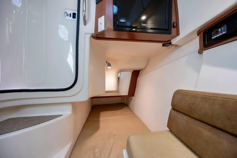  Yacht Photos Pics 2015 Grady-White Freedom 375 cabin interior with TV and seating area.