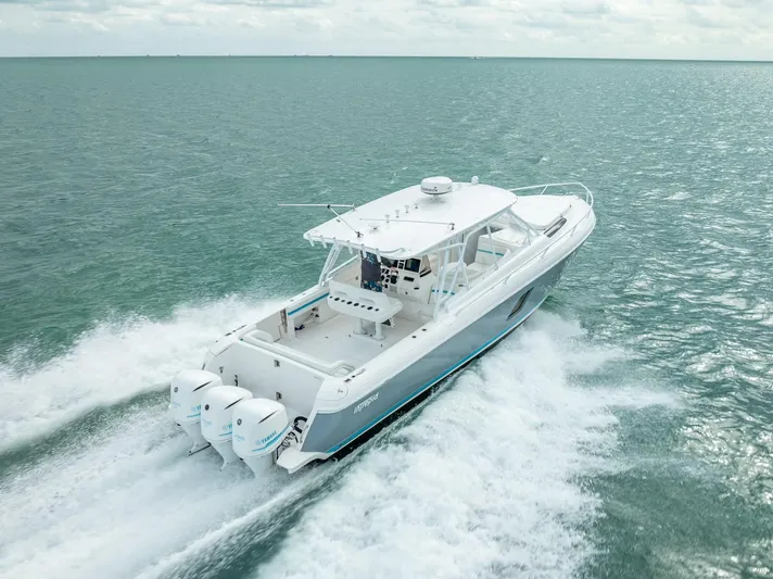  Yacht Photos Pics 2015 Intrepid 400 Cuddy cruising on open water, showcasing powerful triple engines.