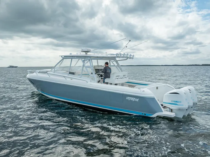 Yacht Photos Pics 2015 Intrepid 400 Cuddy boat on open water, featuring Yamaha engines.