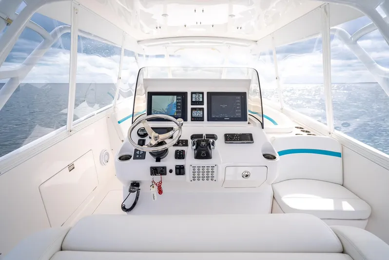  Yacht Photos Pics 2015 Intrepid 400 Cuddy helm with modern navigation equipment and ocean view.