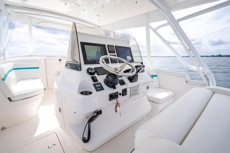  Yacht Photos Pics 2015 Intrepid 400 Cuddy boat interior with modern helm and seating.