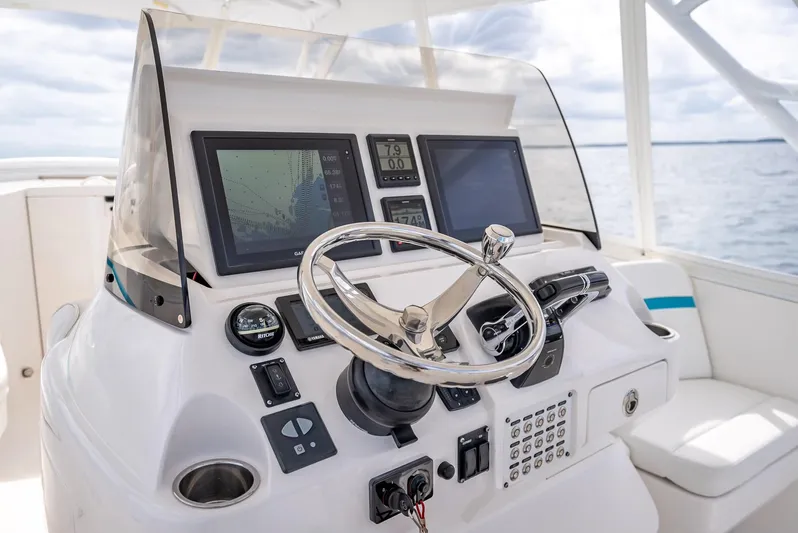 Yacht Photos Pics 2015 Intrepid 400 Cuddy helm with modern navigation displays and steering wheel.