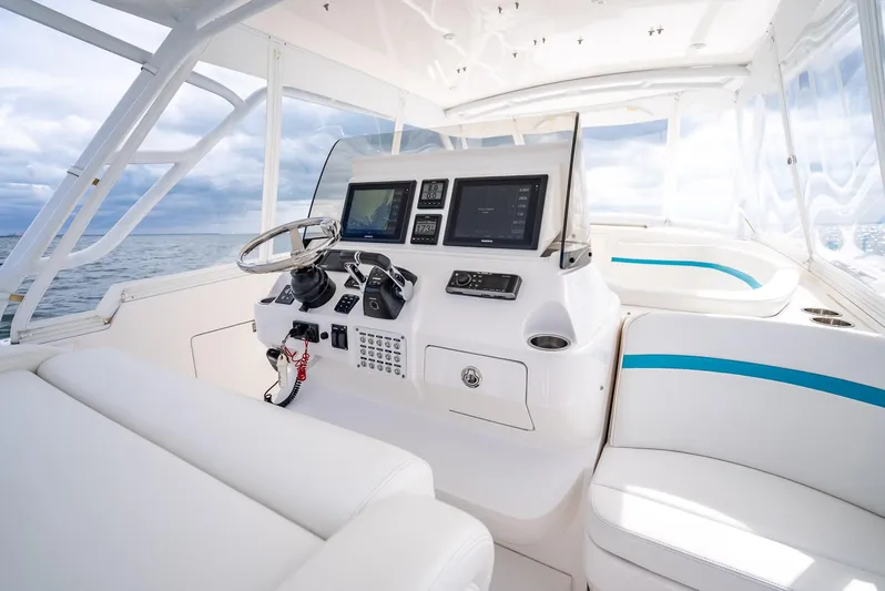  Yacht Photos Pics 2015 Intrepid 400 Cuddy boat interior with modern helm and seating.