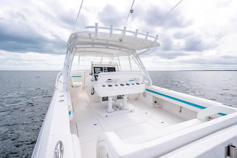  Yacht Photos Pics 2015 Intrepid 400 Cuddy boat on open water under cloudy sky.