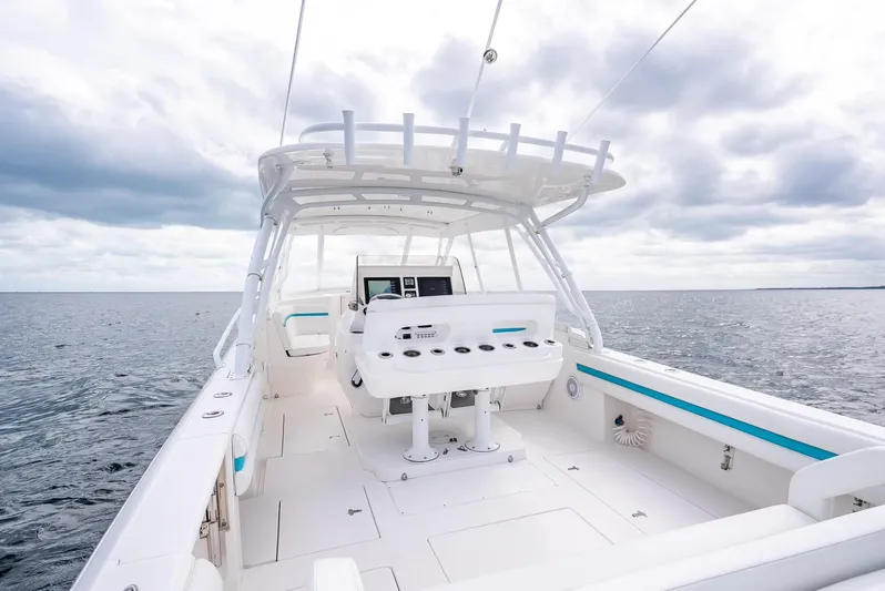  Yacht Photos Pics 2015 Intrepid 400 Cuddy boat on open water under cloudy sky.