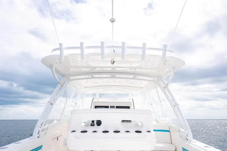  Yacht Photos Pics 2015 Intrepid 400 Cuddy boat, featuring a sleek helm and open ocean view.
