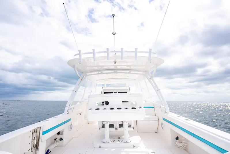  Yacht Photos Pics 2015 Intrepid 400 Cuddy boat on open sea under cloudy sky.