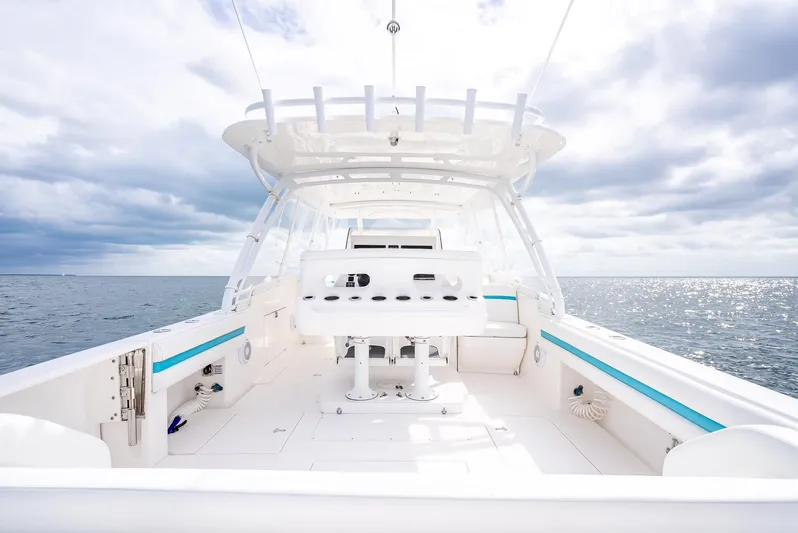  Yacht Photos Pics 2015 Intrepid 400 Cuddy boat interior with ocean view and cloudy sky.
