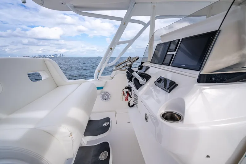  Yacht Photos Pics 2015 Intrepid 400 Cuddy boat interior with modern dashboard and ocean view.