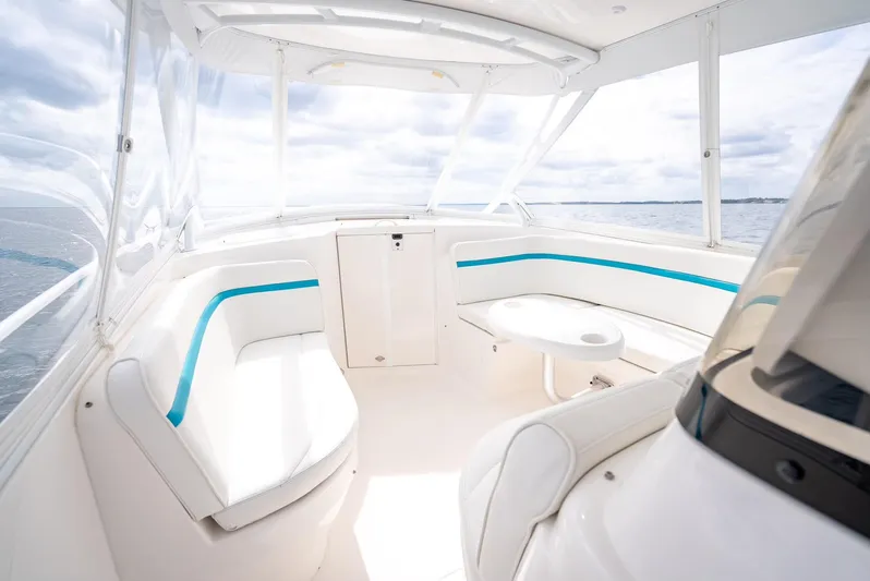  Yacht Photos Pics 2015 Intrepid 400 Cuddy boat interior with white seating and blue accents.