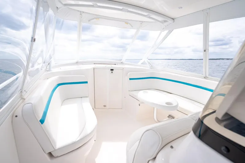  Yacht Photos Pics 2015 Intrepid 400 Cuddy interior with white seating and ocean view.