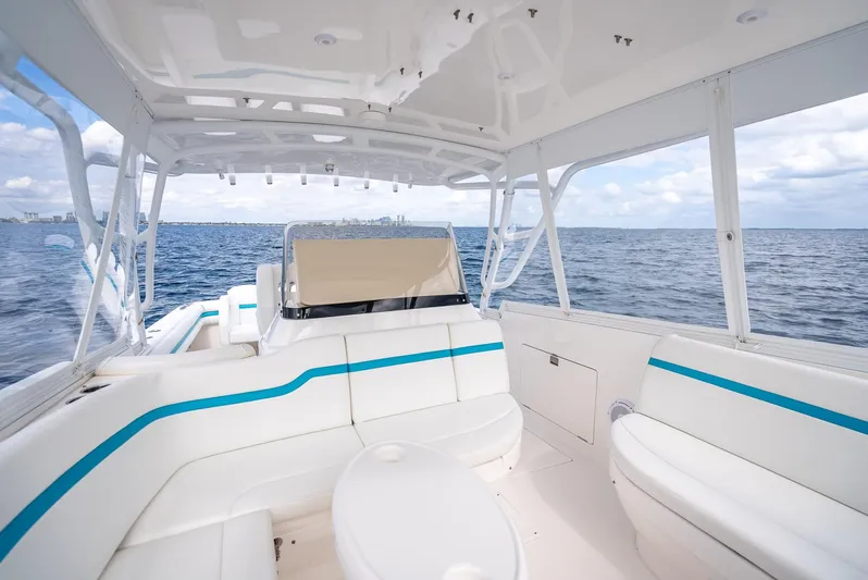  Yacht Photos Pics 2015 Intrepid 400 Cuddy boat interior with white seating and ocean view.
