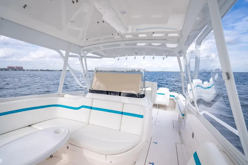  Yacht Photos Pics 2015 Intrepid 400 Cuddy boat interior with white seating and ocean view.