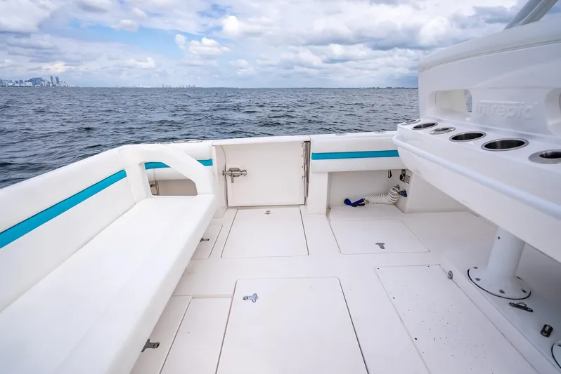  Yacht Photos Pics 2015 Intrepid 400 Cuddy boat deck with ocean view and seating area.
