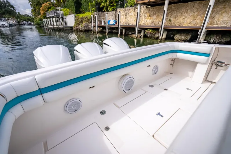  Yacht Photos Pics 2015 Intrepid 400 Cuddy boat interior with white seating and blue accents.