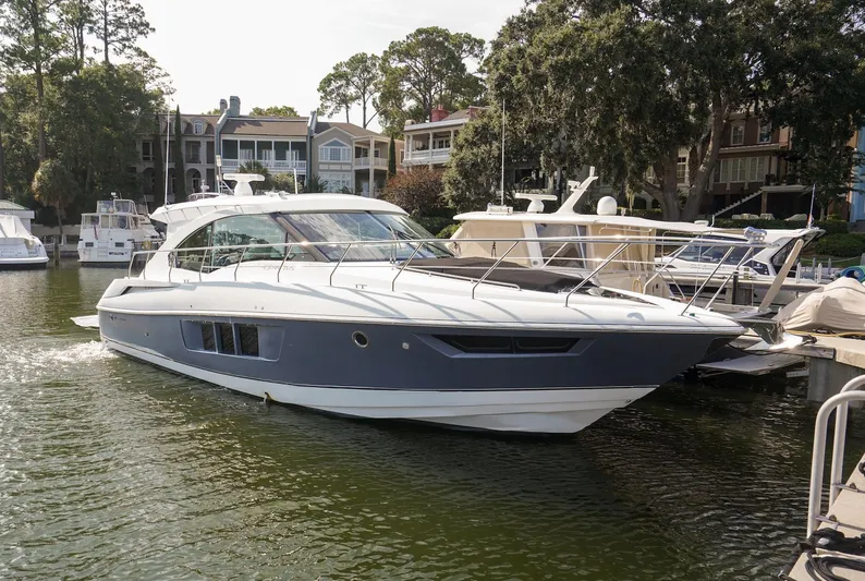  Yacht Photos Pics 2016 Cruisers Yachts 45 Cantius docked in a scenic marina setting.