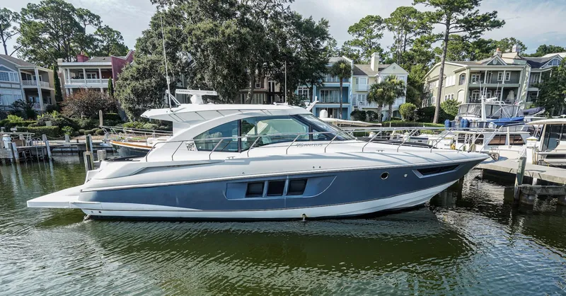 Yacht Photos Pics 2016 Cruisers Yachts 45 Cantius docked near waterfront homes.