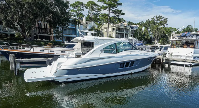  Yacht Photos Pics 2016 Cruisers Yachts 45 Cantius docked in a scenic marina setting.