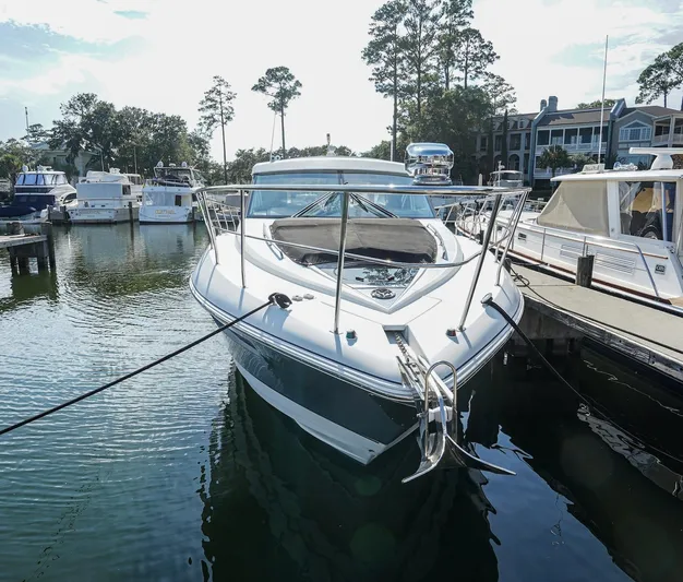  Yacht Photos Pics 2016 Cruisers Yachts 45 Cantius docked at marina, surrounded by other boats.