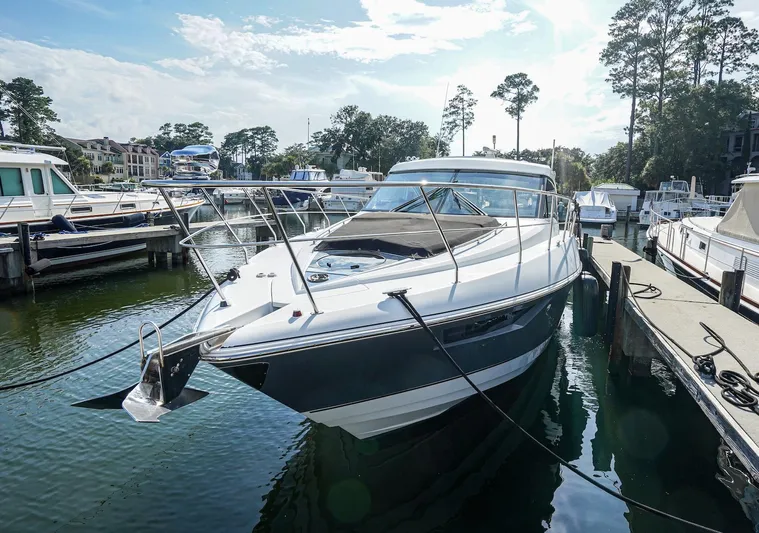  Yacht Photos Pics 2016 Cruisers Yachts 45 Cantius docked at marina, surrounded by other boats.