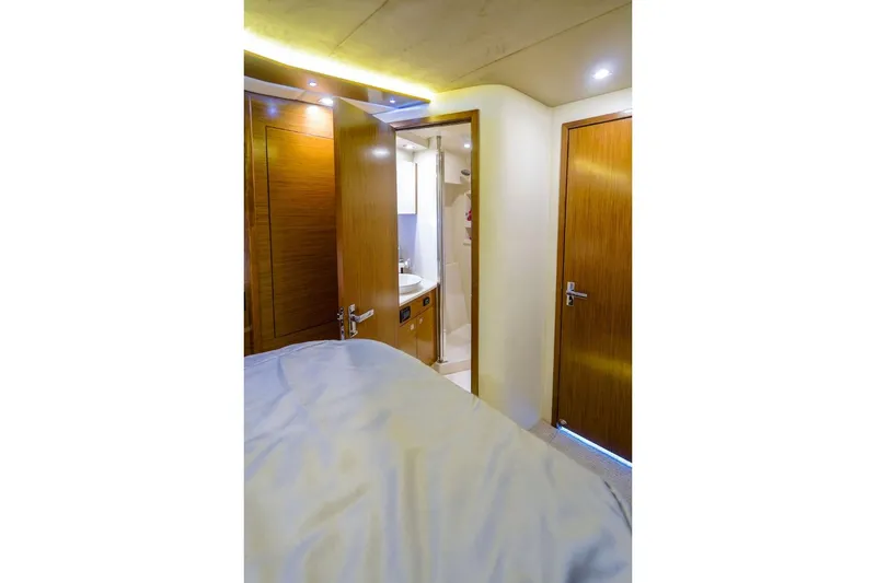  Yacht Photos Pics Interior of 2016 Cruisers Yachts 45 Cantius, featuring a cozy cabin and bathroom.