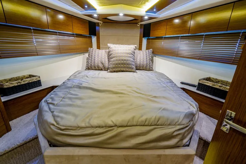  Yacht Photos Pics Luxurious bedroom interior of 2016 Cruisers Yachts 45 Cantius with modern design and cozy bedding.
