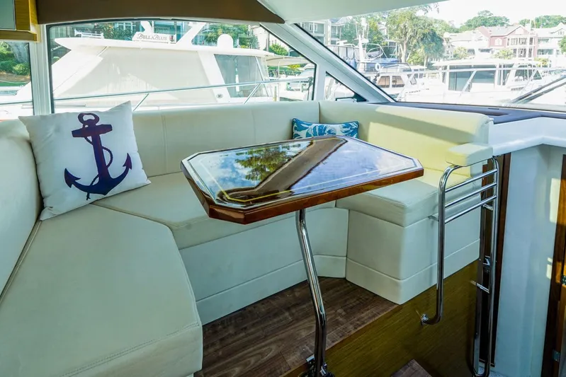  Yacht Photos Pics Luxurious interior of 2016 Cruisers Yachts 45 Cantius with elegant seating and nautical decor.