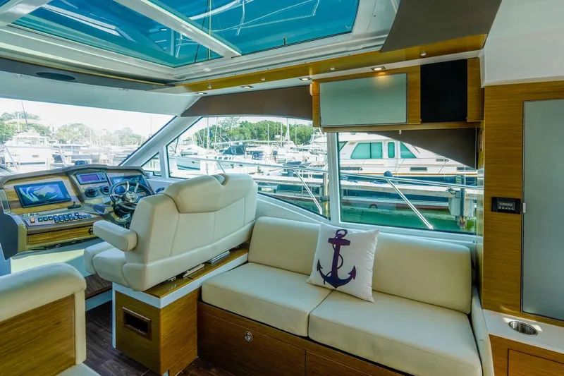  Yacht Photos Pics Interior of 2016 Cruisers Yachts 45 Cantius with helm and seating area.