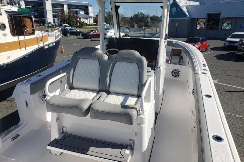  Yacht Photos Pics 2023 Everglades 285CC boat interior with dual seats and modern design.