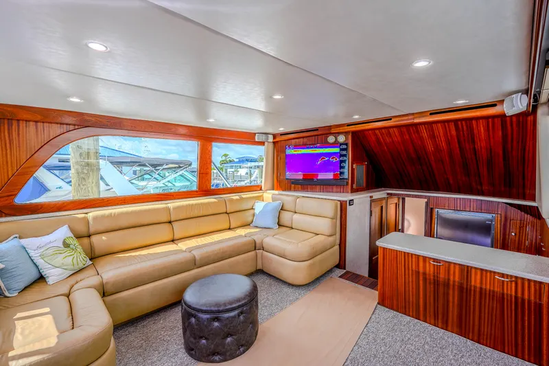 Julia G Yacht Photos Pics Luxurious interior of 1982 Hatteras 46 Convertible yacht with plush seating and modern amenities.