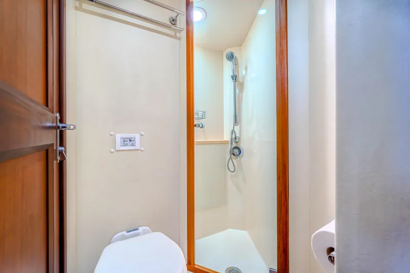 Julia G Yacht Photos Pics Bathroom interior of 1982 Hatteras 46 Convertible yacht with shower and toilet.