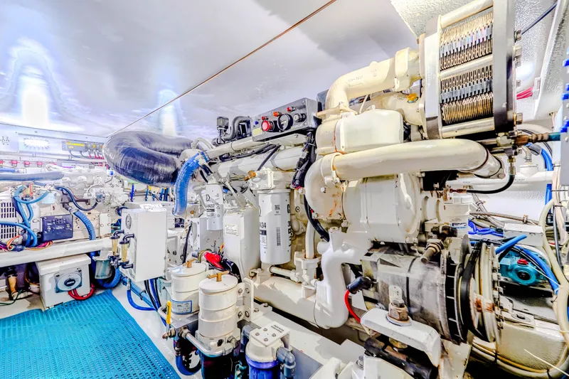 Julia G Yacht Photos Pics Engine room of 1982 Hatteras 46 Convertible yacht, showcasing mechanical components and systems.