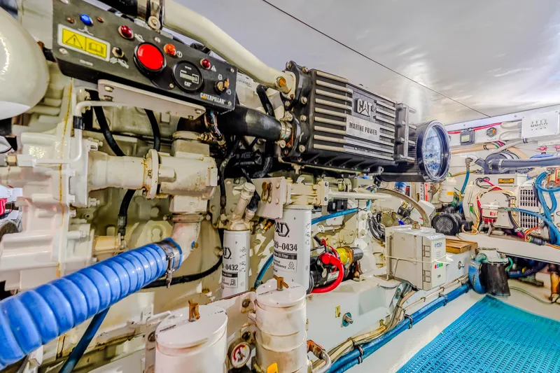 Julia G Yacht Photos Pics Engine room of 1982 Hatteras 46 Convertible yacht, showcasing detailed machinery and components.
